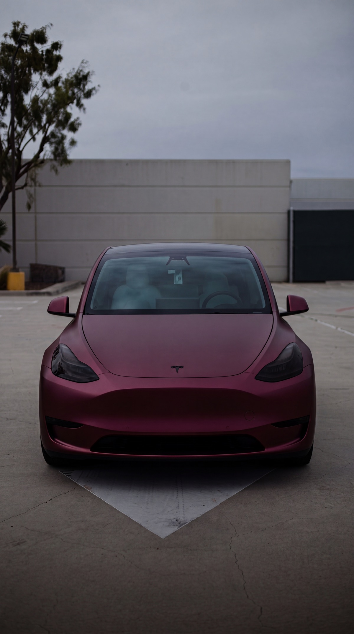 Tesla Model Y in a deep pink color change wrap